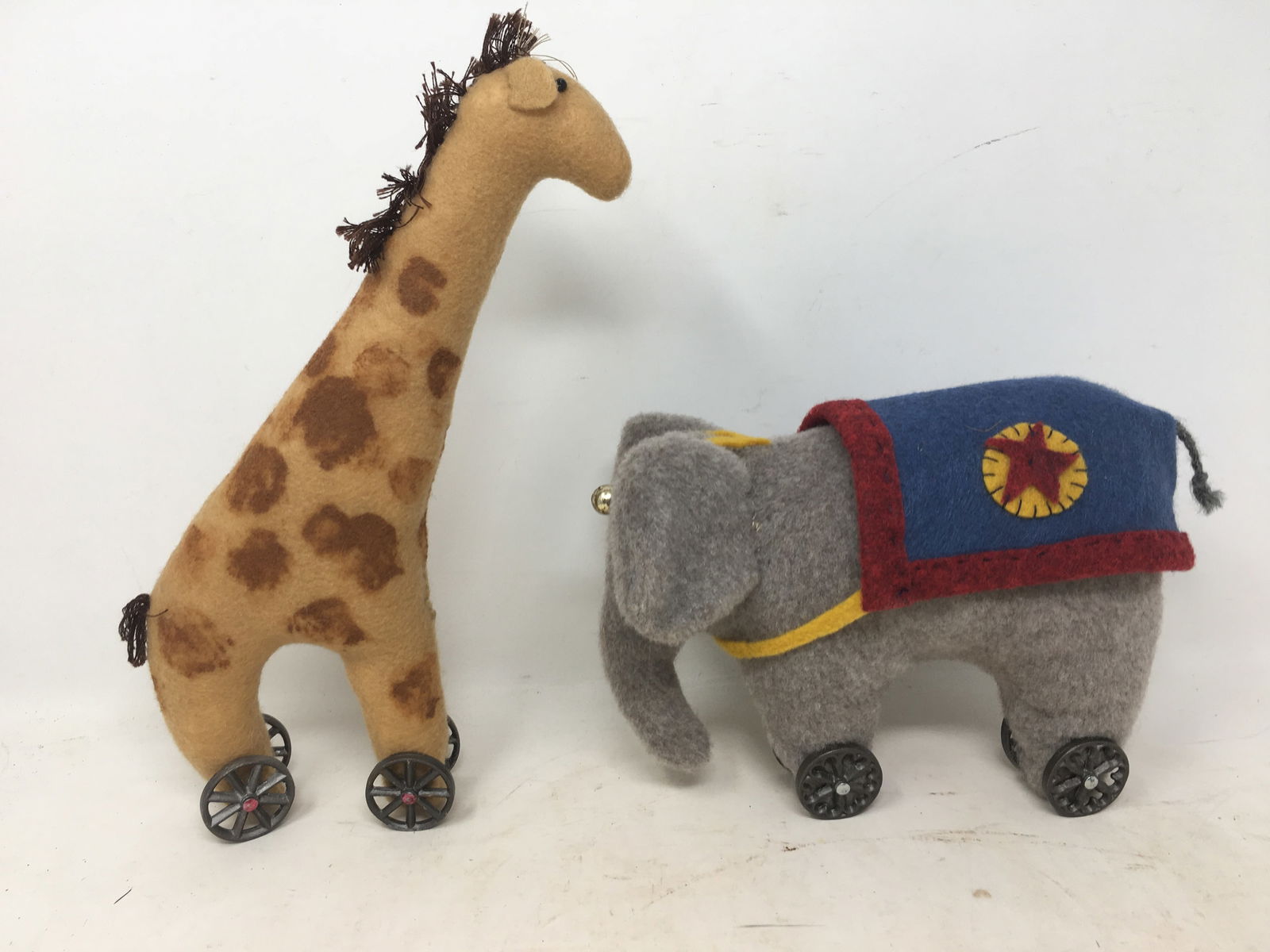 (2) Felt Pull Toys: (2) Felt Pull Toys. 1) Elephant 8"L x 4.5"W x 6"H; 2) Giraffe Pull-Toy 6"L x 2"W x 10"H