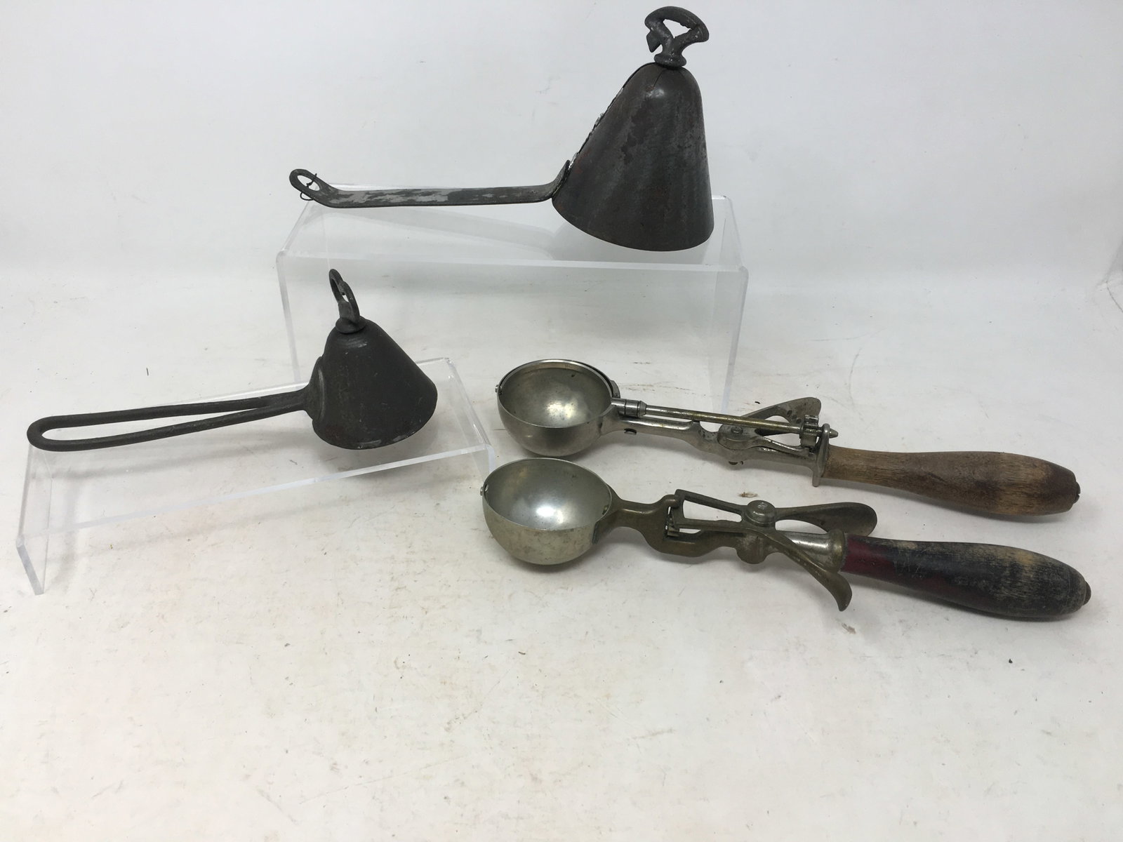 (4) Antique Ice Cream Scoops: (4) Antique Ice Cream Scoops. (2) Tin cone-shaped scoops, one marked Lad's Disher No. 16; Dover Mfg Co. No. 20; Gilchrist's No. 31. Longest 11"