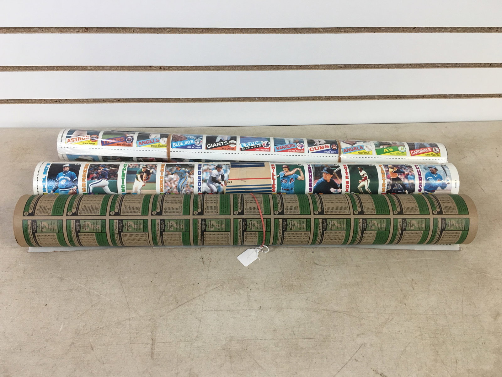 1979, 1984, 1985 Topps Uncut Baseball Card Sheets: 1979 Topps Uncut Baseball Card Sheet, Rolled. Tear on one card, Tim Foli. 1984 & 1985 Topps Uncut Baseball Card Sheets, 1985 is factory sealed but plastic torn on ends.