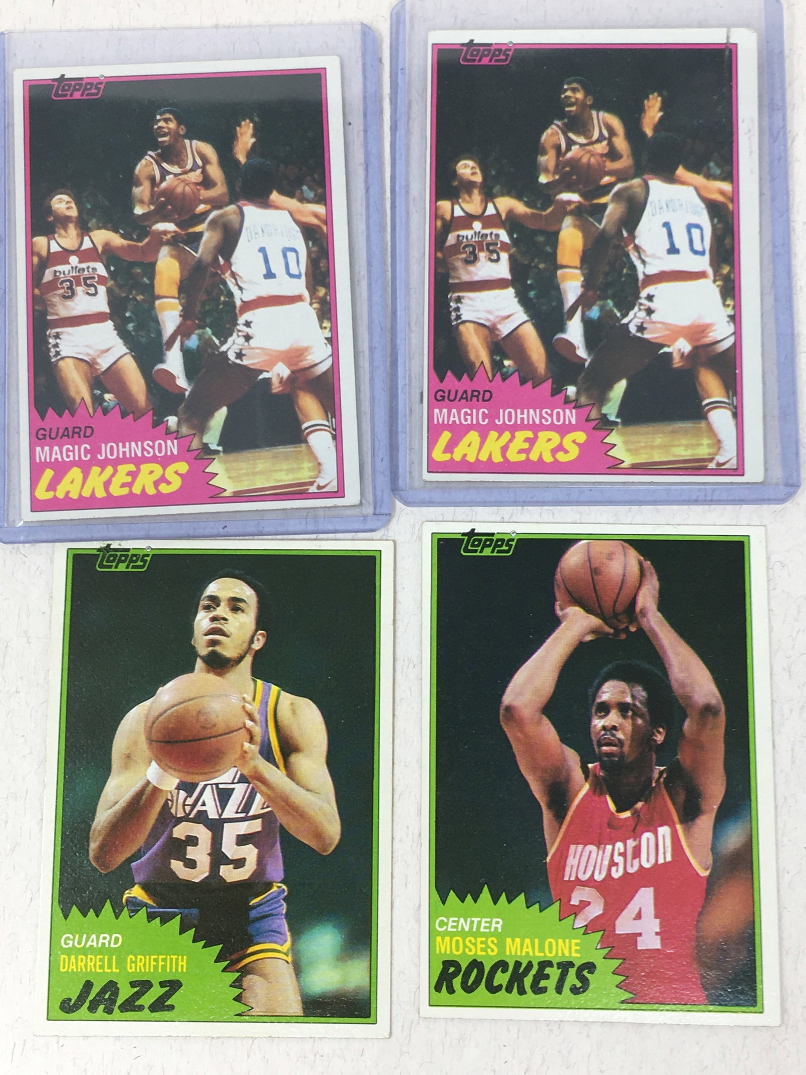 (4) 1981 Topps Basketball Cards, Magic Johnson: (4) 1981 Topps Basketball Cards. (2) Magic Johnson #21; Darrell Griffith #41; Moses Malone #14