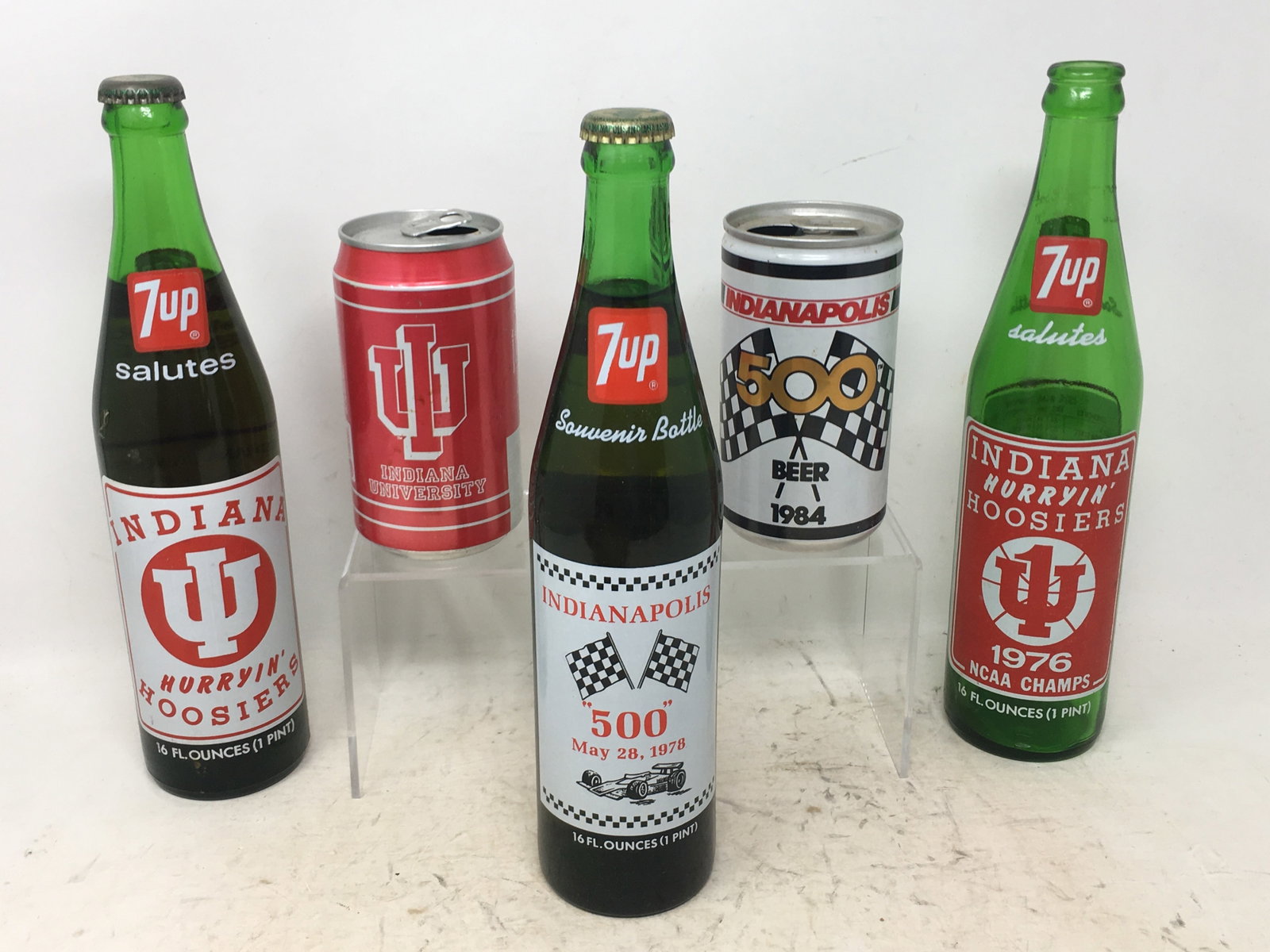 Vintage Indiana University, Indianapolis 500 Bottles & Cans: Vintage Indiana University, Indianapolis 500 Bottles & Cans. (2) 7Up Salutes Indiana Hurryin' Hoosiers (1 is 1976 NCAA Champs); Indiana Cola can; 7Up Souvenir Bottle, Indianapolis 500, 1978;