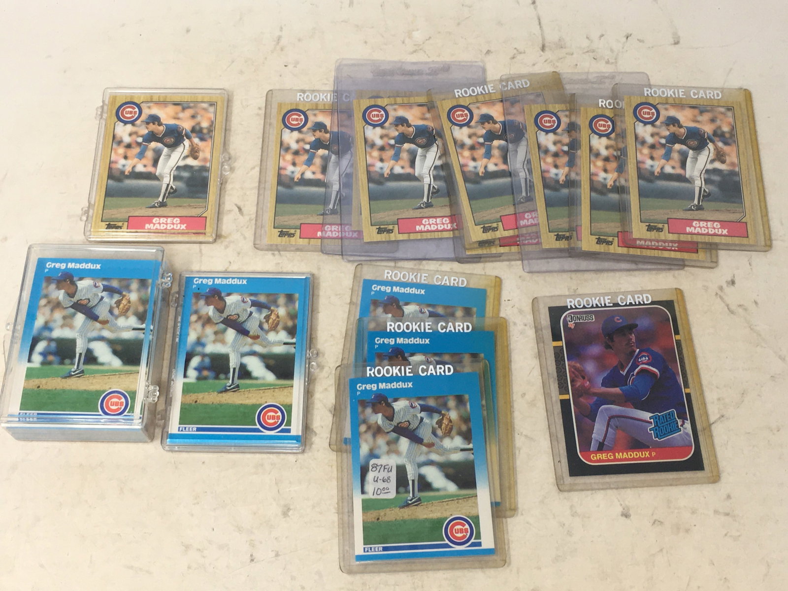 (61) Greg Maddux Rookie Baseball Cards: (61) Greg Maddux Rookie Baseball Cards. Incl. (1) 1987 Donruss #36; (12) Topps 1987 #70T; (48) 1987 Fleer #U-68