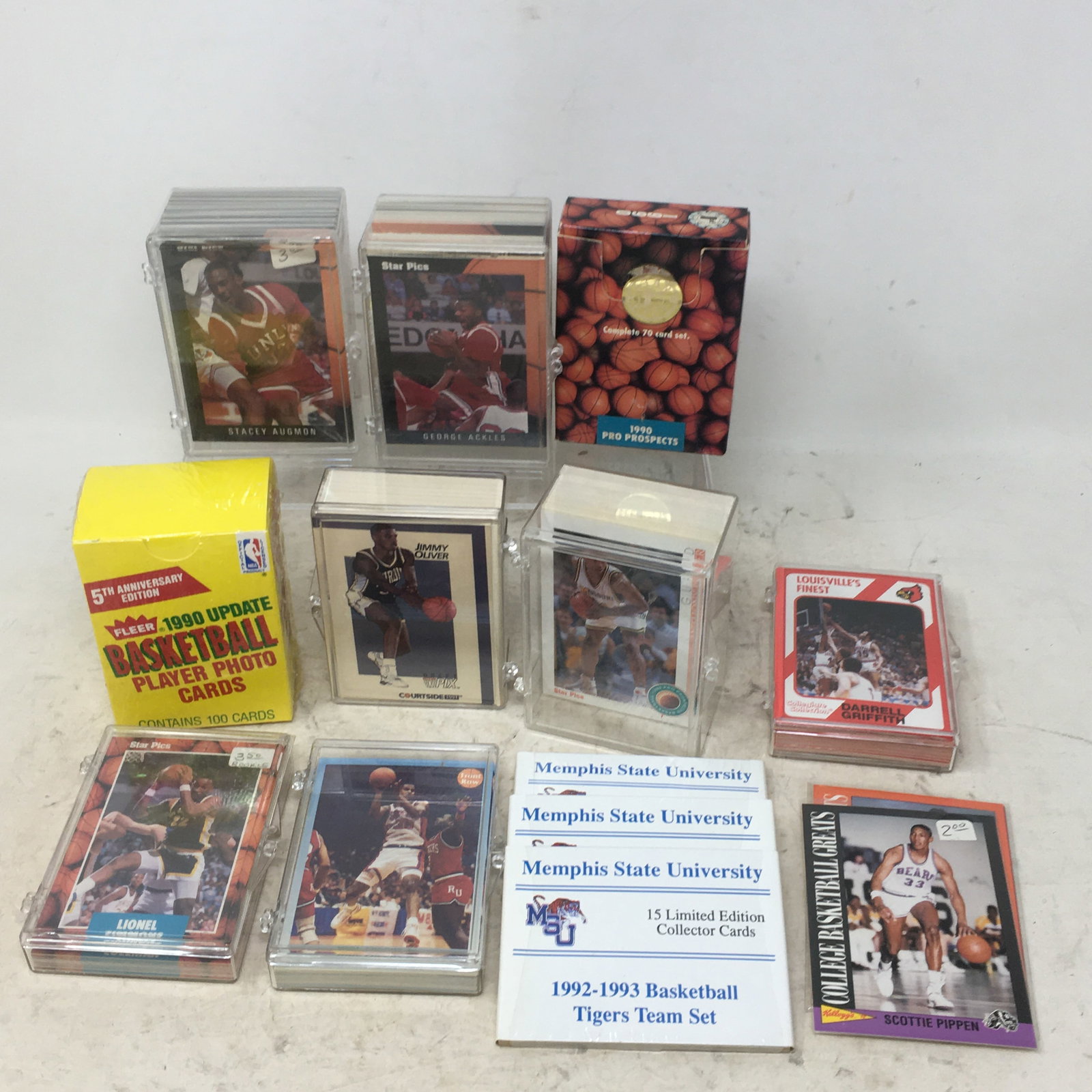 Group of Early 1990s Basketball Cards: Group of Early 1990s Basketball Cards. Incl. 1990, 1991, 1992 Star Pics; 1991 Courtside; Fleer 1990 Update, sealed; Louisville Cardinals & Memphis State University team cards.