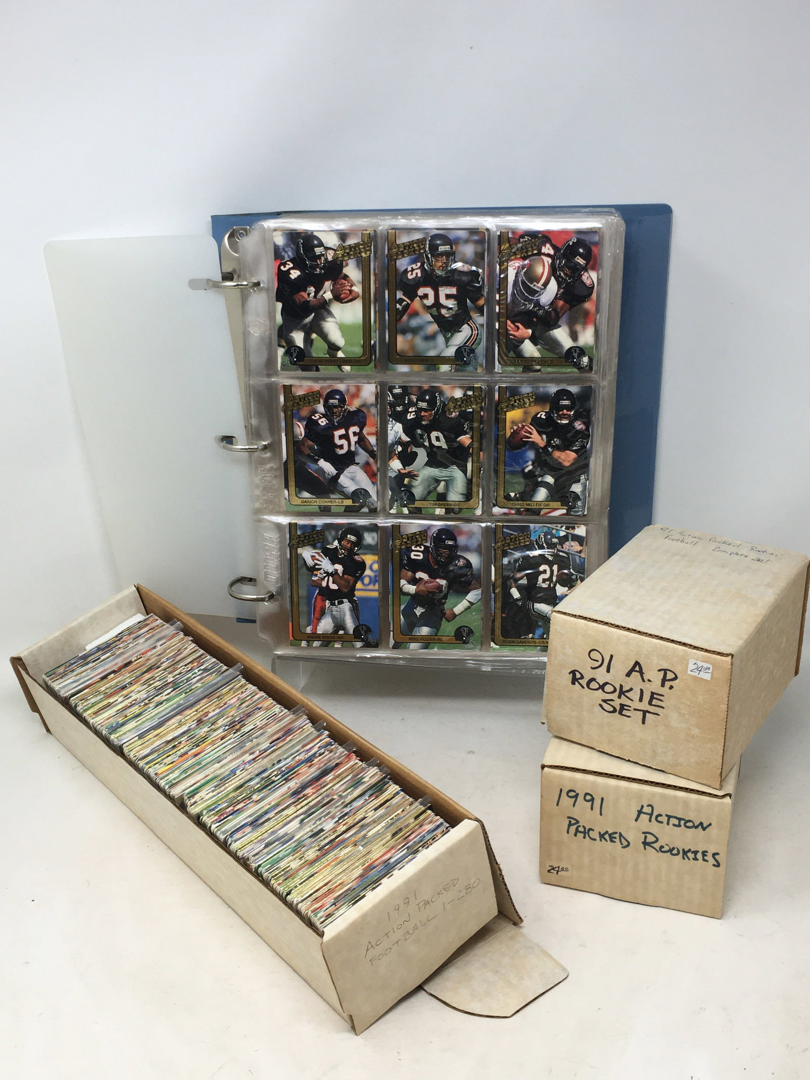 1991 Action Packed NFL Football Card Sets: 1991 Action Packed NFL Football Cards, (2) Sets #1-280; (2) Rookies Sets #1-84. Also incl. 1 Braille card (Haywood Jeffries) , & 1 24k gold card (Charles Haley).