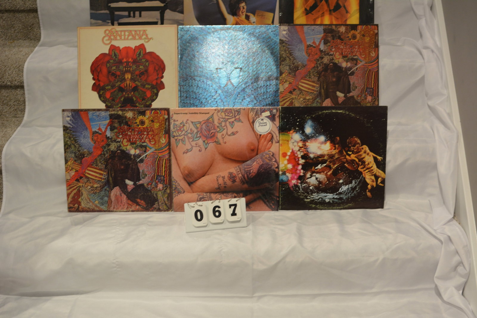 Classic Rock Vinyl LP Collection (9 Records): Mixed lot of vintage rock LPs featuring albums by Supertramp and Santana.Included titles visible in the collection:SupertrampEven in the Quietest Moments…Breakfast in AmericaIndelibly StampedSantana