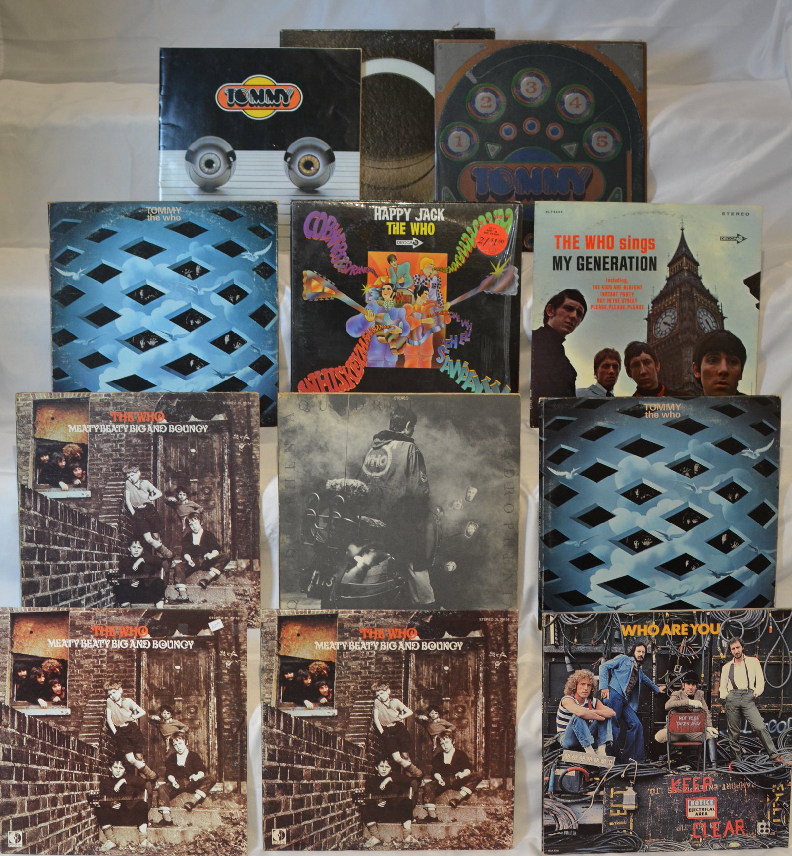 The Who Vinyl LP Collection (11 Records): Rock vinyl collection featuring albums by The Who, including classic studio releases, compilations, and multiple copies of collectible titles.Titles included: Tommy (box set with inserts/booklet visib