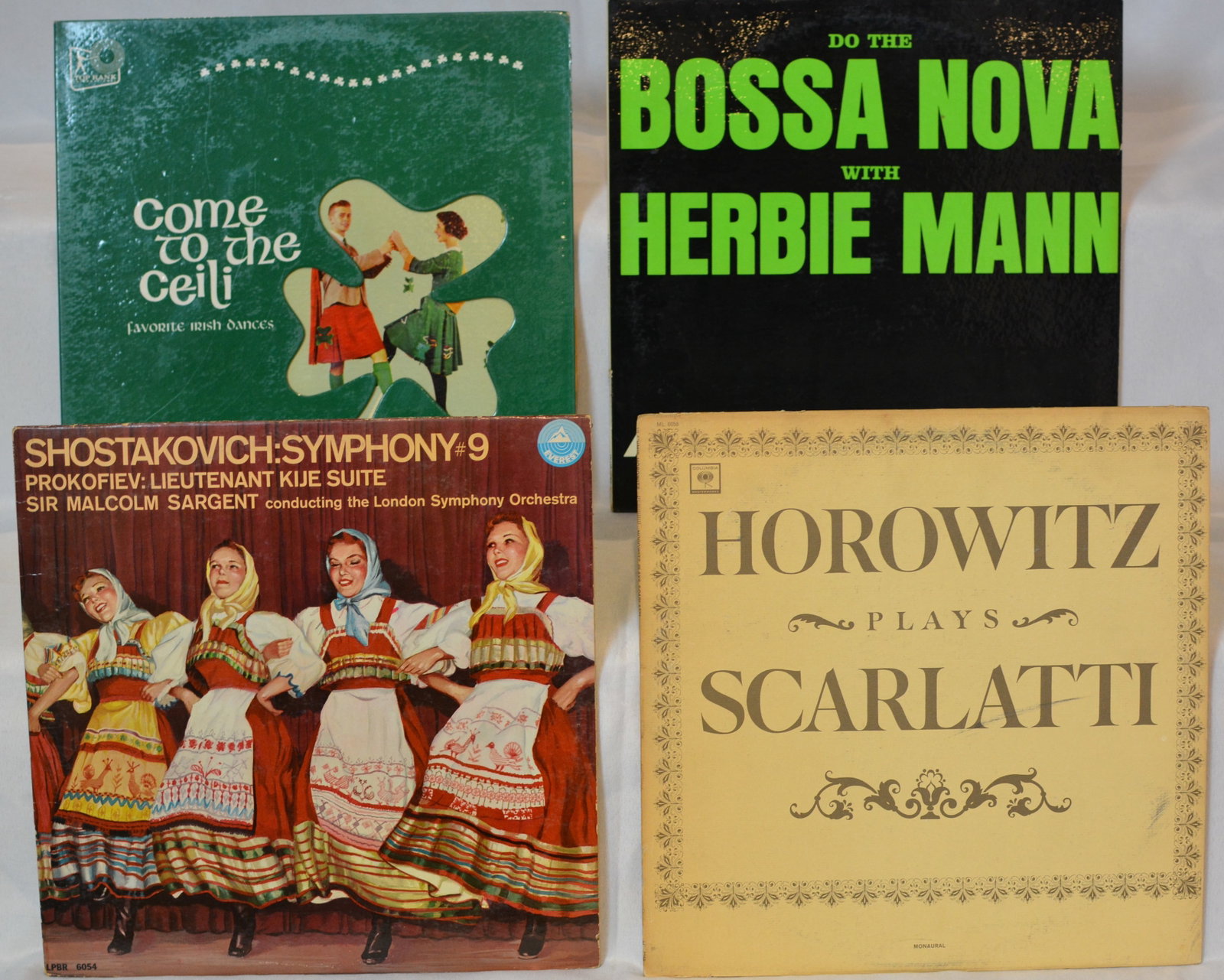 Vintage Mixed Vinyl LP Lot ? Herbie Mann, Horowitz, Shostakovich, Irish Dance & Classical Records: Small mixed vinyl LP collection featuring jazz, classical, folk, and international music recordings.Albums visible include:Herbie Mann ? Do the Bossa NovaVladimir Horowitz ? Horowitz Plays ScarlattiSh