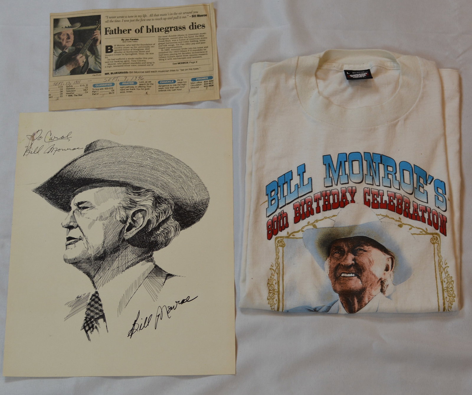 Bill Monroe Memorabilia Group: Vintage Bill Monroe bluegrass memorabilia collection featuring a signed portrait print, commemorative birthday celebration T-shirt, and memorial newspaper clipping.