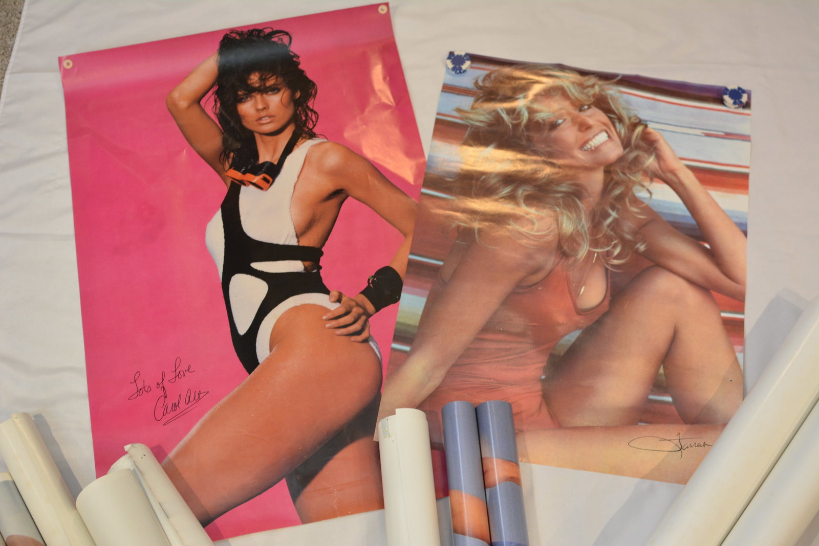 Large Vintage Glamour & Celebrity Poster Lot Farrah Fawcett, Carol Alt, Loni Kaye,& More: Large assorted collection of vintage 1970s-1980s glamour posters. This extensive lot includes numerous rolled posters along with several opened examples featuring iconic pop culture and swimsuit image