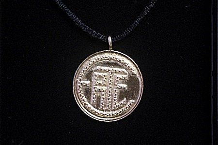 "Erte Initials" Yellow Gold Pendant Necklace By Erte: "Erte Initials" Circle Shape; Yellow Gold Pendant Necklace By Erte; Bearing the Signature of the artist; Size Approx 10 in.