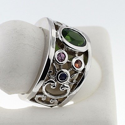 SILVER RING WITH CHROME DIOPSIDE AND MULTISAPPHIRE: Stone : CHROME DIOPSIDE Metal : SILVER Cts: 1.00 Finish : POLISHED shape : OVAL Gmwt: 6.50 color: GREEN Size:6 Stone: SAPPHIRE Cts:0.12