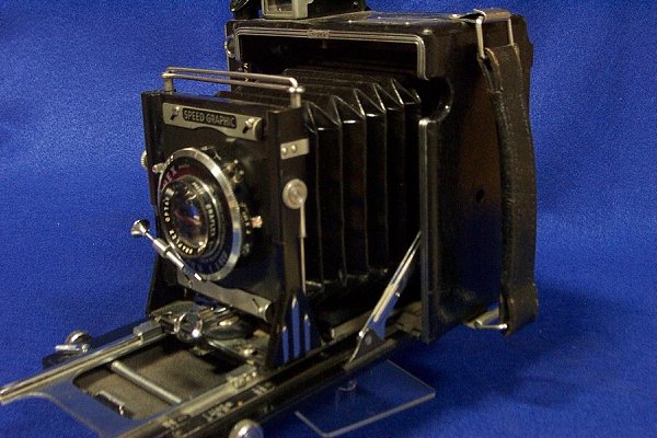 Speed Graphic Camera by Graflex with Box and More: Circa 1940 Comes with its original carrying case which is in fair condition. Contents include DEJUR light meter, 8 film holders, filters and range finder.