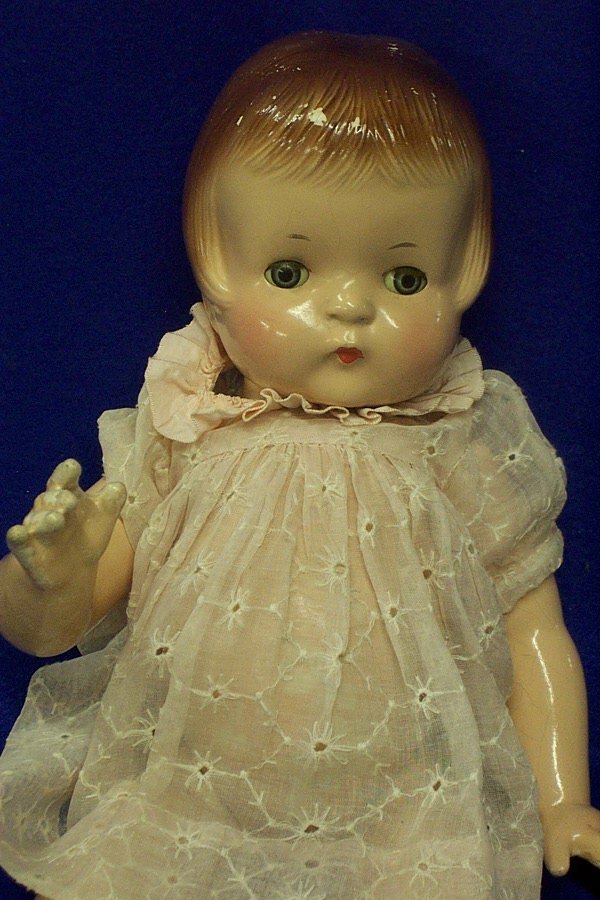 Patsy Ann Effanbee Doll: This Patsy Ann Doll is 19" long and has marking PatsyAnn c Pat 1283558 1929 on her back. Some of the paint is coming off of her body and head. There is also some crazing on her face. She has 3 d