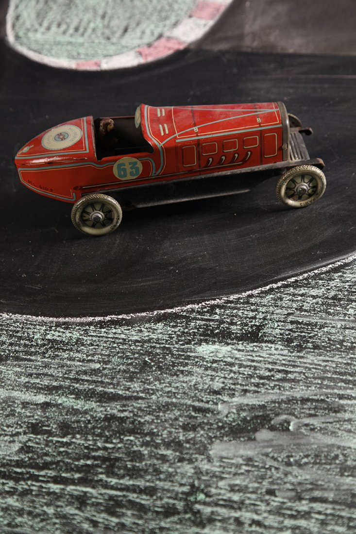 France Mecanique 1930 ML-Paris: Voiture de course #63Avec chauffeur. En tôle lithographiee. Sans boiteL. 21 cmSheet steel litho racing car with driver #63
