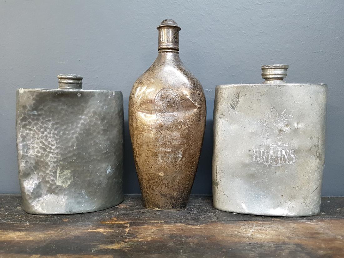 Lot Of 3 Antique Flasks, Engraved: Lot Of 3 Antique Flasks, Engraved English Pewter, Sheffield Engraved "brains" 5" X 4" English Pewter, Hammered 3.5" X 4.5" Invictus Maneo 6.25" X 2.5"