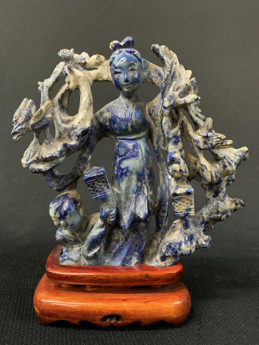 Chinese Sodalite Carved Guan Yin On Stand: Chinese Sodalite Carved Guan Yin On Stand. 6" H X 5" W Including Stand.