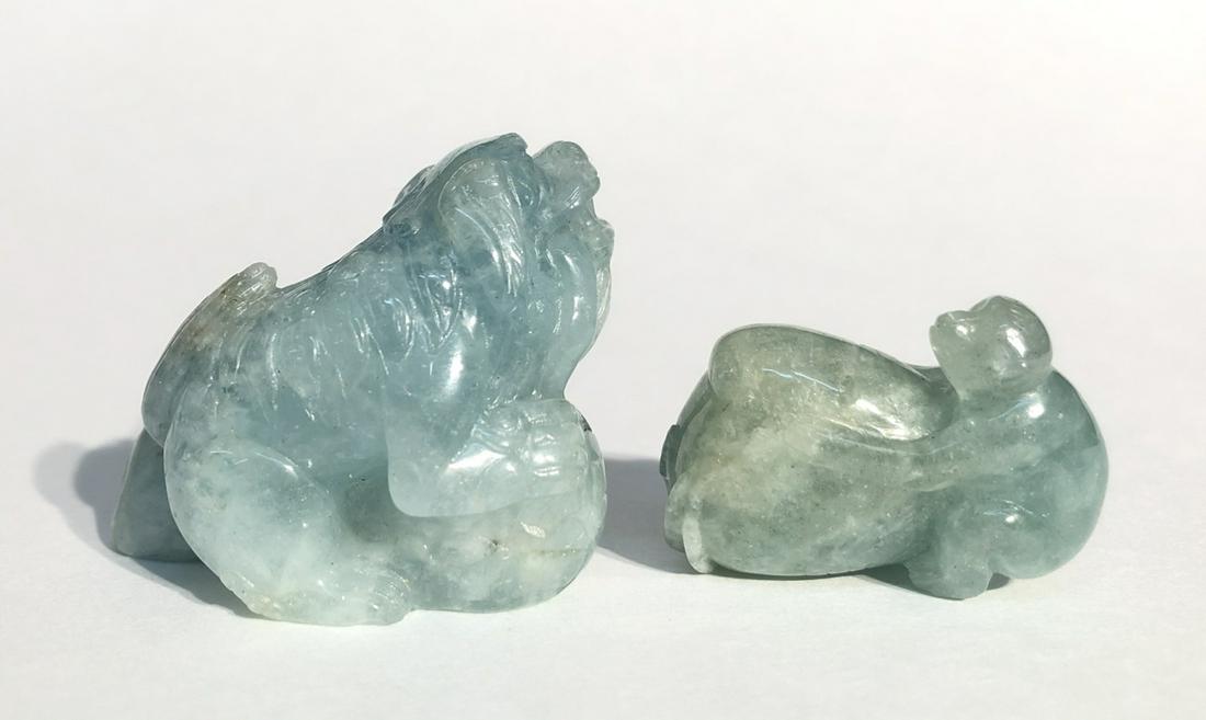 Chinese Crystal Aquamarine Or Tourmeline Carvings: Two Chinese Crystal Aquamarine Or Tourmeline Carvings. Largest: 2"w x 1.5"hKeywords: Chinese, Chinese Antiques, Asian, Asian Art, Asian Antiques, Chinese Jade, Jade, Chinese Porcelain, Blue and White,