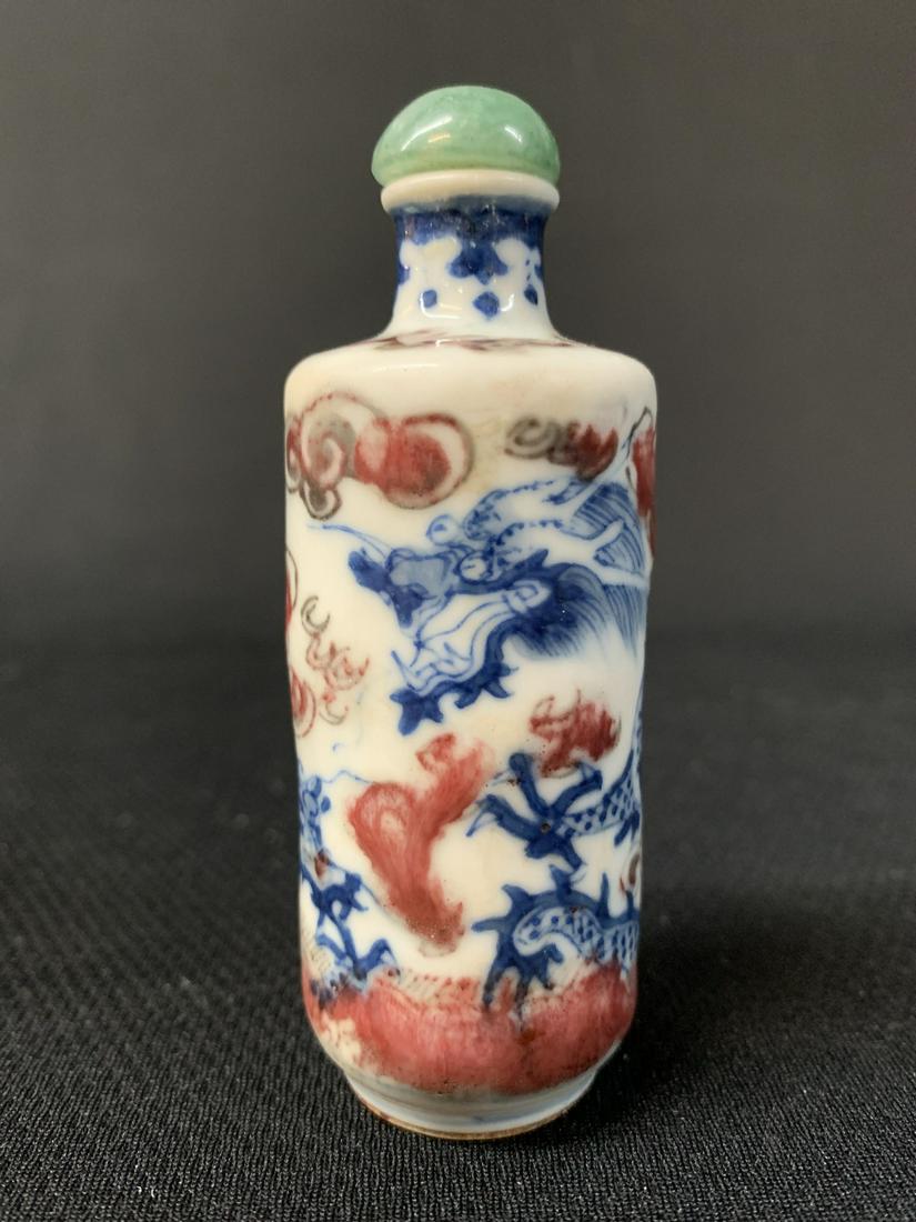 Antique Chinese Blue White Red Snuff Bottle Dragon: Antique Chinese Blue White Red Porcelain Snuff Bottle, Flying Dragon In The Clouds With Jade Stopper. Measures 3.75 Inches. Keywords: Chinese, Chinese Antiques, Asian, Asian Art, Asian Antiques, Chine