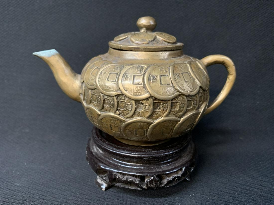 Chinese Brass Coin Teapot On Stand: Chinese Brass Coin Teapot On Stand. Teapot Measures 5 W X 3.25 Inches High. Keywords: Chinese, Chinese Antiques, Asian, Asian Art, Asian Antiques, Chinese Jade, Jade, Chinese Porcelain, Blue and White