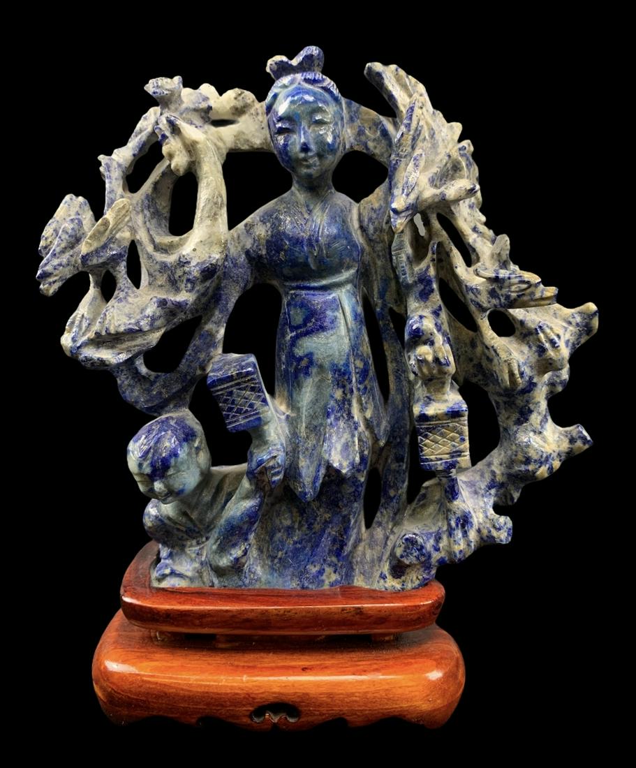 Chinese Sodalite Carved Guan Yin On Stand: Chinese Sodalite Carved Guan Yin On Stand. 6 X 4.5 Inches.