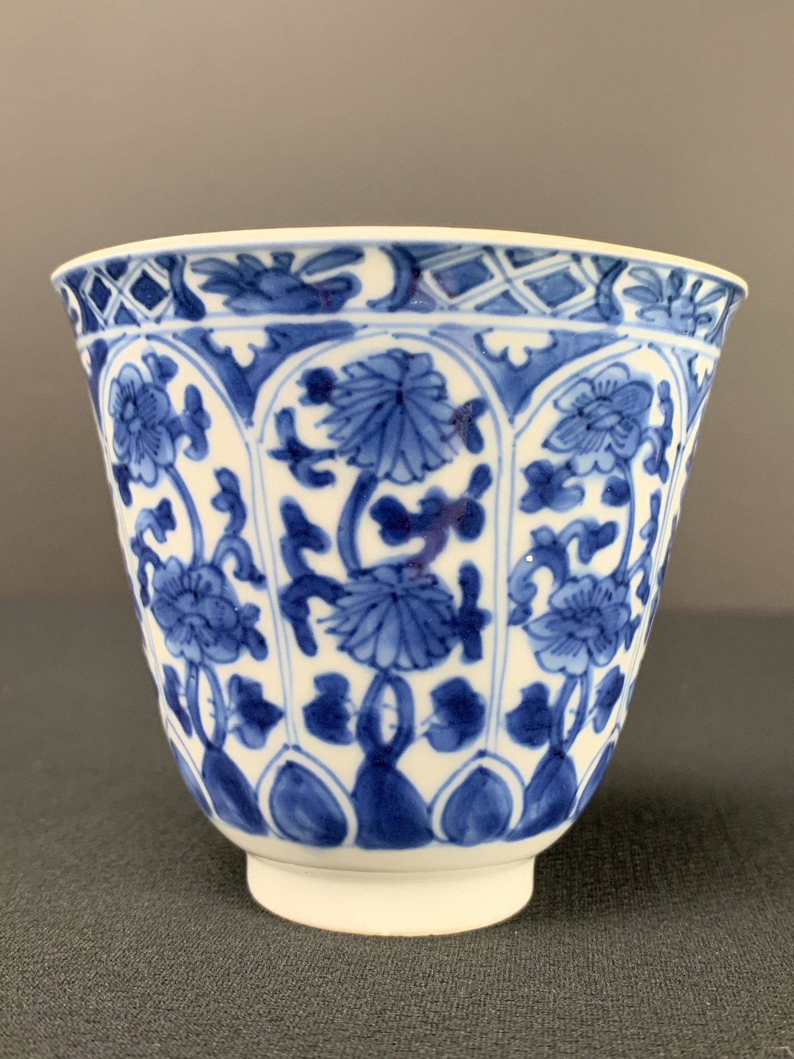 Chinese Flow Blue & White Footed Teacup: Chinese Flow Blue & White Footed Teacup. Marked On The Underside. Chip Flea Bites To Rim., Please See Photos. 2.75 X 3.25 Inches