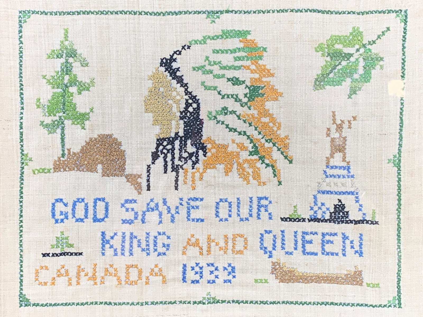 Vintage 1939 Canada Sampler With Indian Chief: Vintage 1939 Canada Sampler With Indian Chief. God Save Our King And Queen Canada 1939. Oak Frame Measures 12.5" H X 15.5" W.
