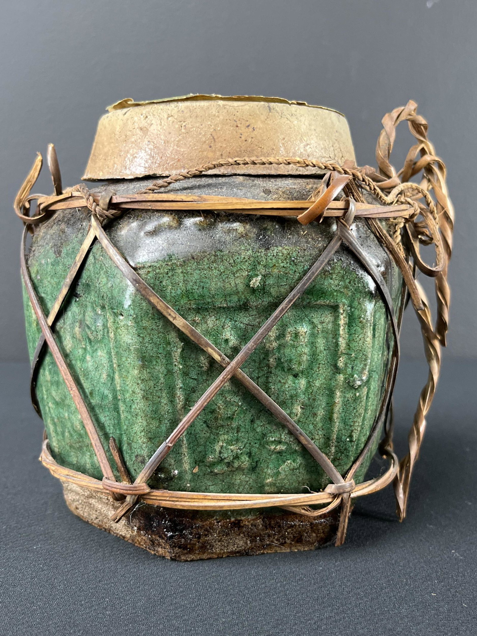 Rare 1920s Hong Kong Sealed Ginger Jar: Rare 1920s-30s Sealed Hong Kong Hexagonal Ginger Jar In Raffia With Earthenware Lid And Cork Seal. 6 Inches H.