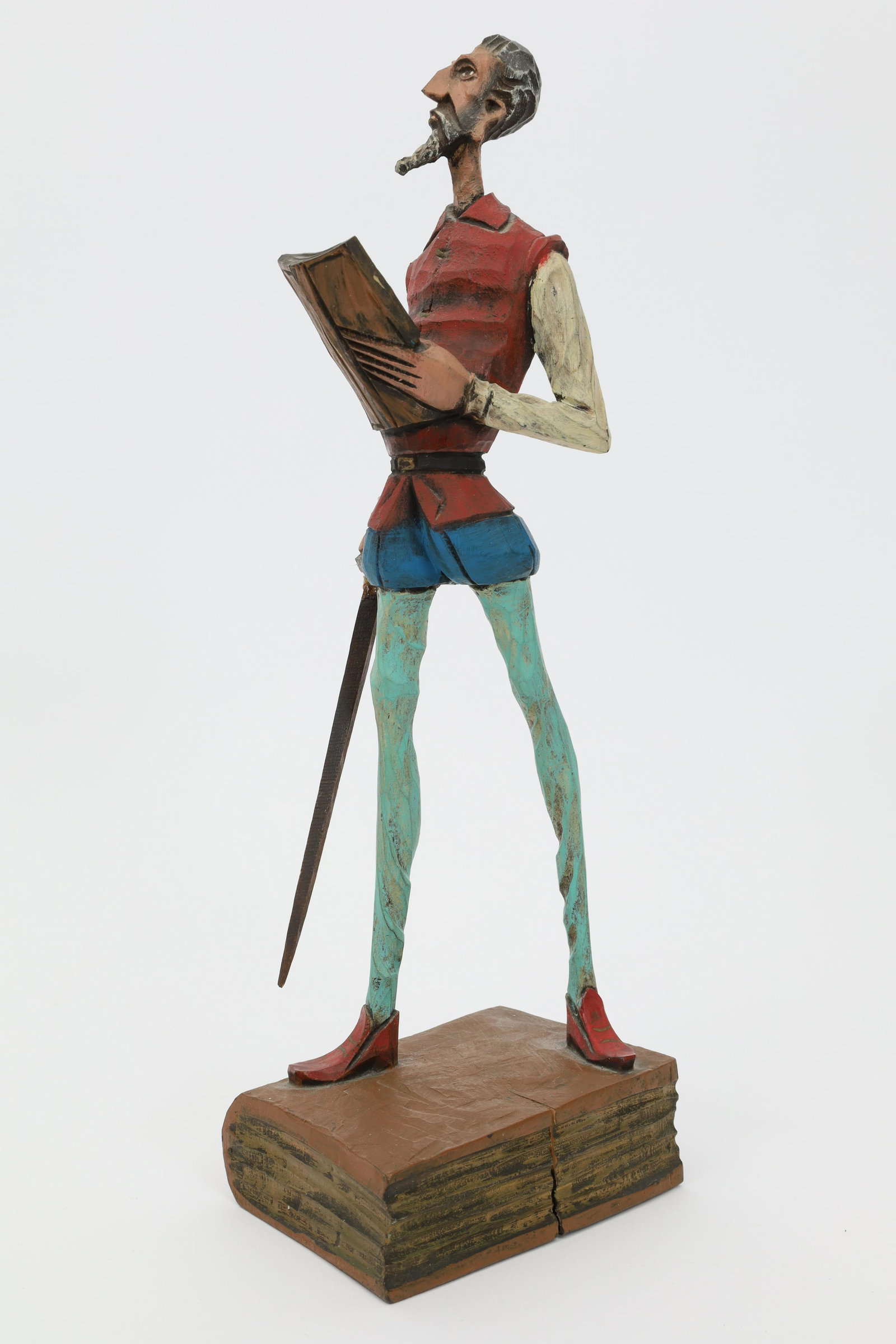 Folk Art Carved Painted Don Quixote Figure: Folk Art Carved Painted Don Quixote Figure. 12 inches H. Sword has been repaired.