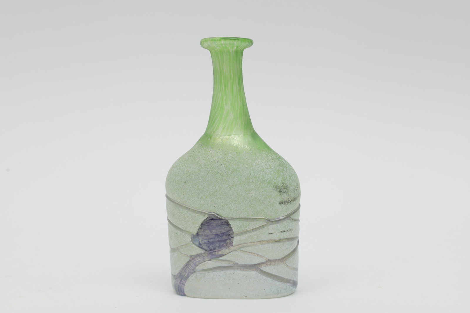 Kosta Boda Sweden Artists Collection Vallien Vase: Kosta Boda art glass small vase from the Artist's Collection, designed by Bertil Vallien of green aurene glass with frosted finish and fused with mottled purple glass, signed on base Kosta Boda Artist