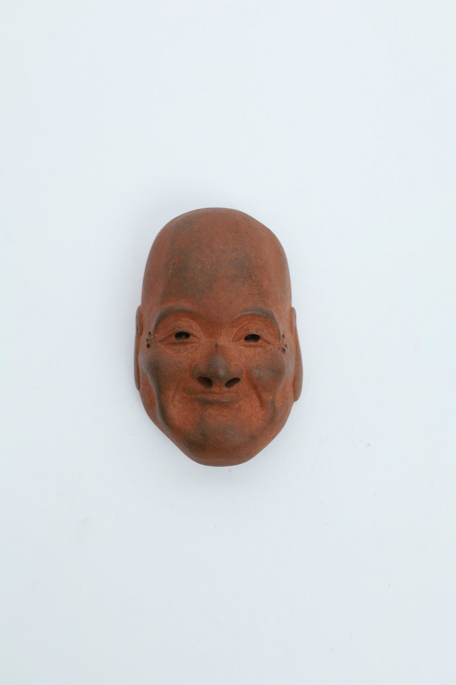 Miniature Japanese Theatre Mask: Japanese Stoneware Netsuke, Smug Expression Face Noh Mask. 2 x 1.25 inches.