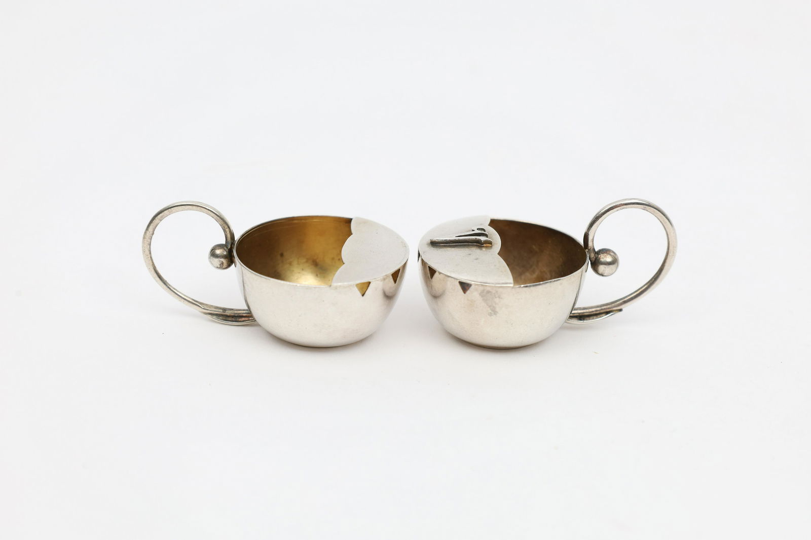 Silver Pea Pod Salt Cellars Carl Poul Petersen: Pair Sterling Silver Pea Pod Salt Cellars Carl Poul Petersen. Weigh 16.5 grams, 1.75 inches L including handles. One monogrammed V. Clearly stamped on bases.