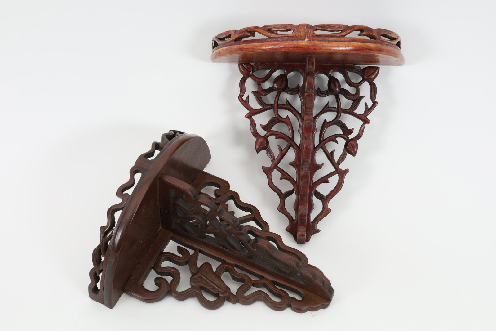 Two Chinese Carved Redwood Wall Shelves: Near Pair Chinese Carved Redwood Wall Shelves. Measure 8 L x 8 W x 4 inches deep.