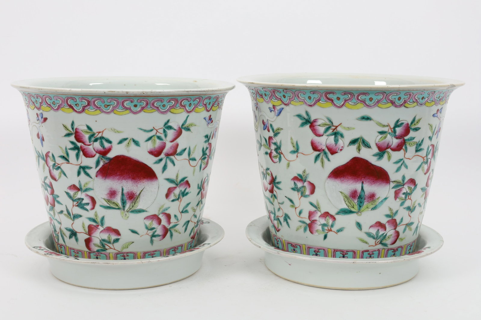 Pair Chinese Peach Pattern Jardiniere Flower Pots: Pair Chinese Peach Pattern Jardiniere Flower Pots. Chip to one planter, base has been restored. 10.5 inches diameter x 9.5 H.