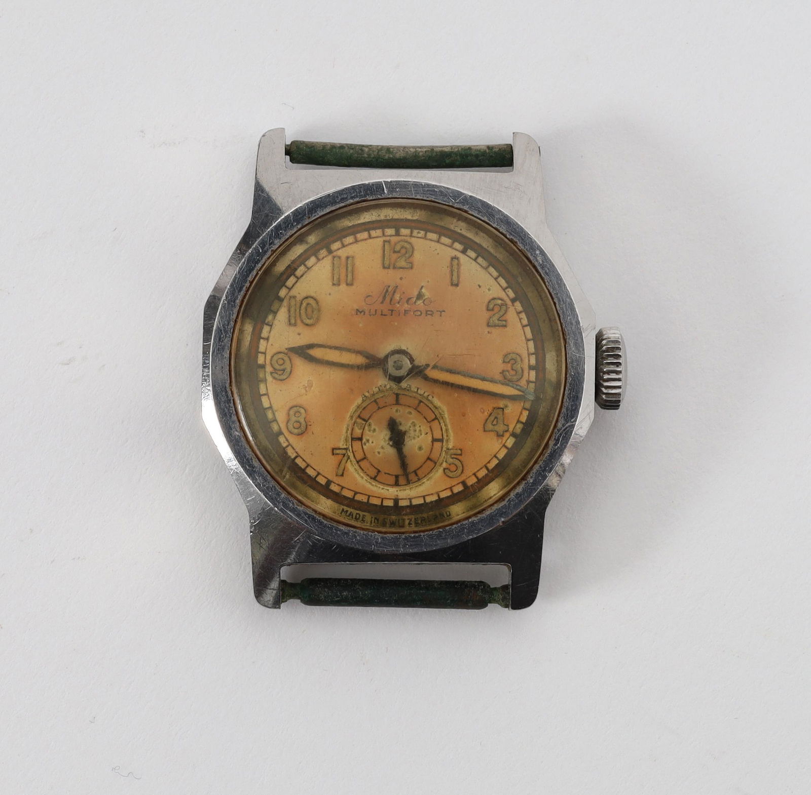 Mido Multifort Automatic Military Watch: Mido Multifort Automatic Military Watch. Some discolouration to the face with a scratch near "Mido", scratched to the glass. Please see photos. 1.25 x 1 inches