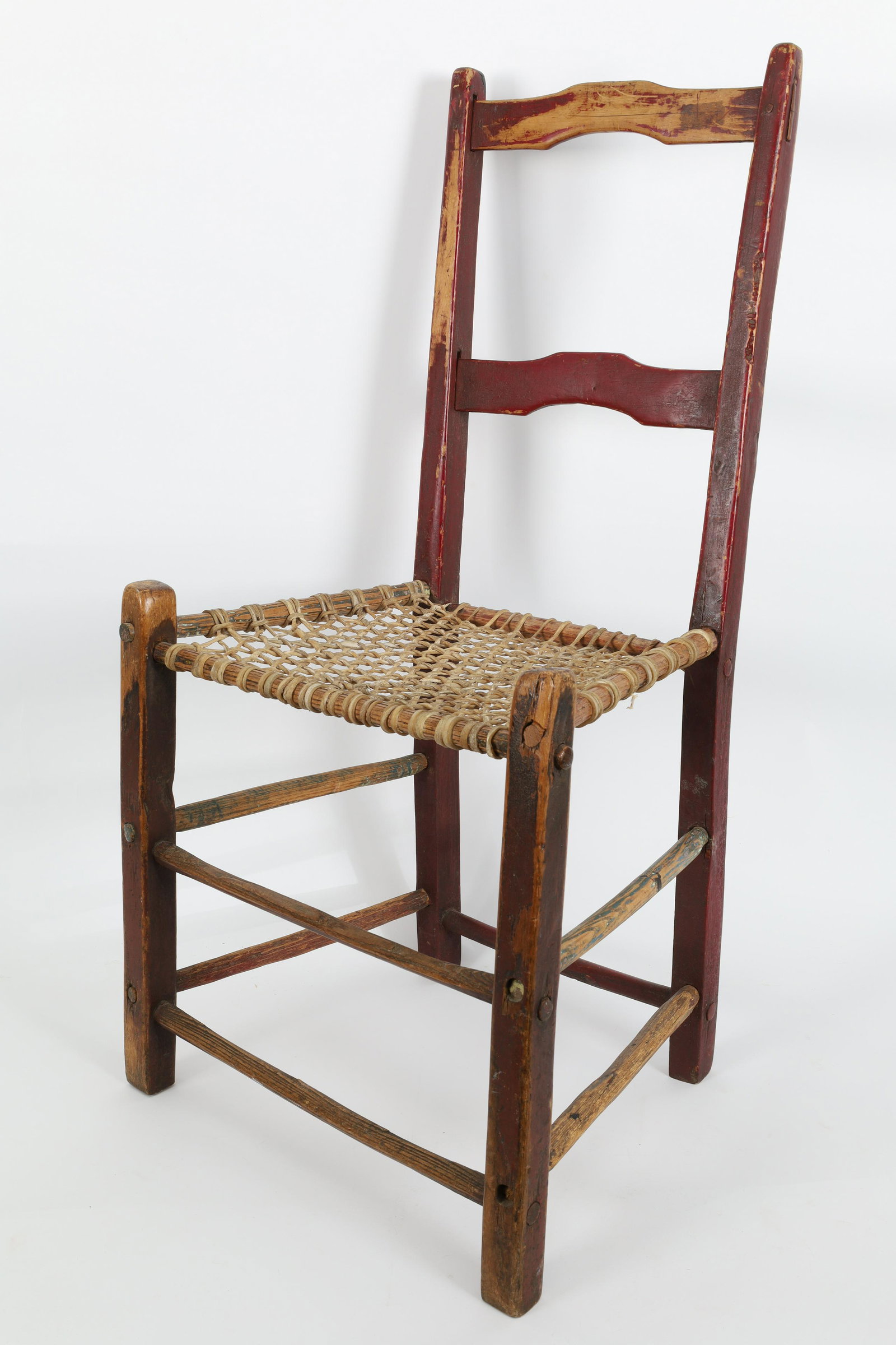 Antique Quebec Canadiana Ladder Back Catgut Chair: Antique Quebec Canadiana Shaped Ladder Back Catgut Chair. Original red paint. 32.5 H x 17 W x 13 inches deep, seat height 16 inches.