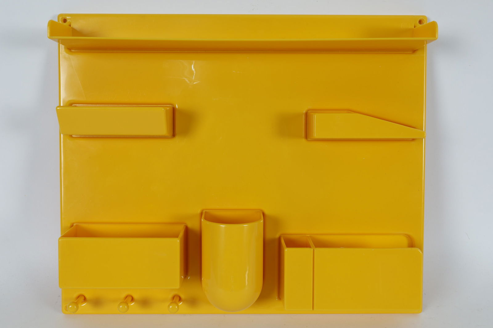 D. Maurer-Becker Yellow Uten Silo Wall Organizer: Original 1970's Pop Art bright yellow plastic wall organizer Uten Silo III by Dorothee Maurer Becker for Design M of Western Germany, designed in 1969. 13.75 x 16.75 x 3 inches deep.