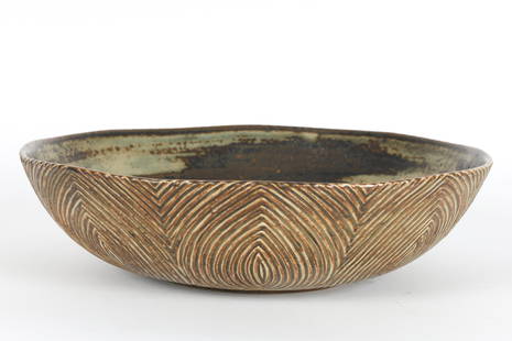 Large Bowl Axel Salto Royal Copenhagen Denmark: Large Bowl by Axel Salto for Royal Copenhagen, Denmark. Unique stoneware bowl decorated with an exterior carved line pattern and Sung glaze interior, signed on base. Measures 11.5 inches diameter x 3