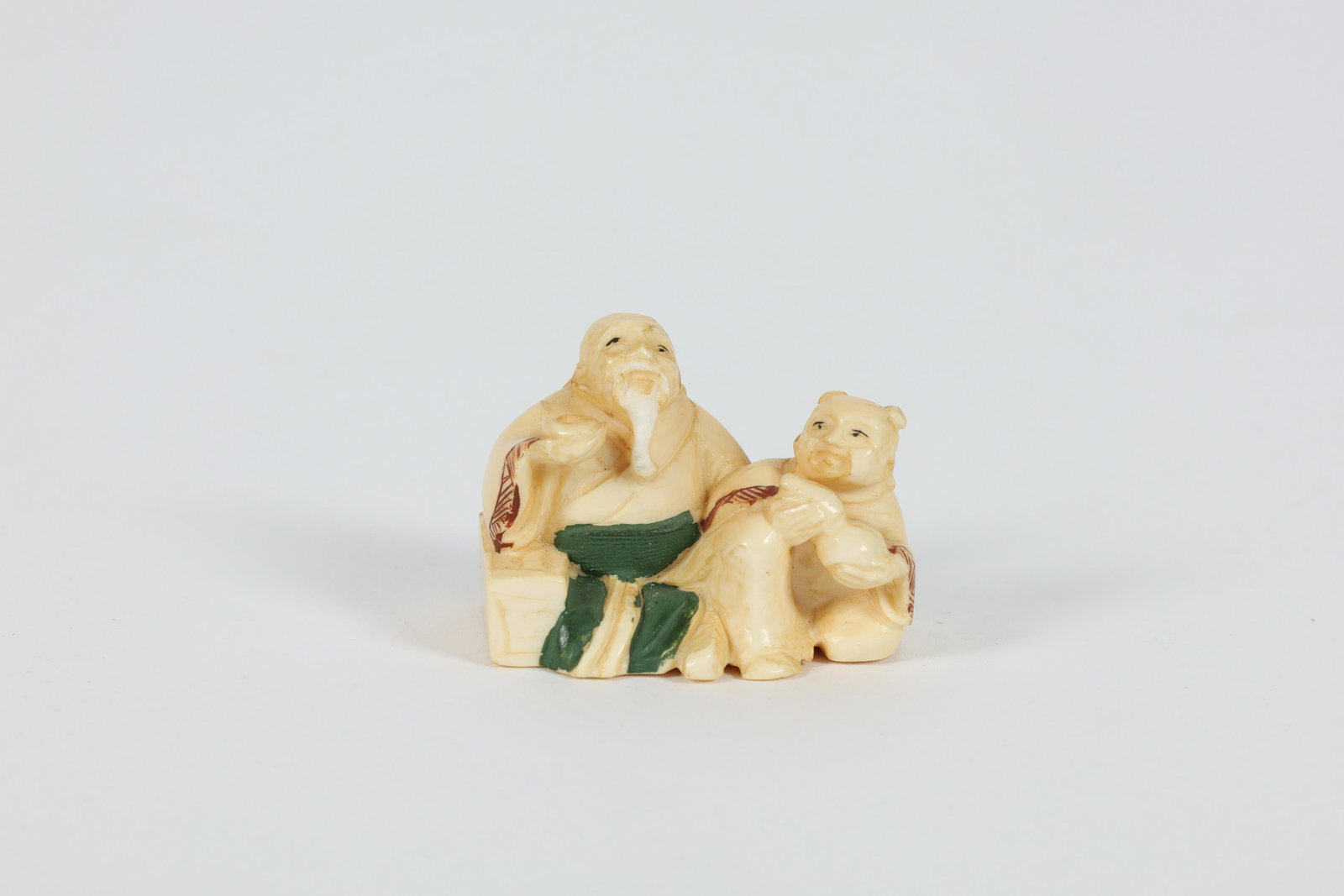 Japanese Netsuke of Old Man with Cup and Child (1 of 6)
