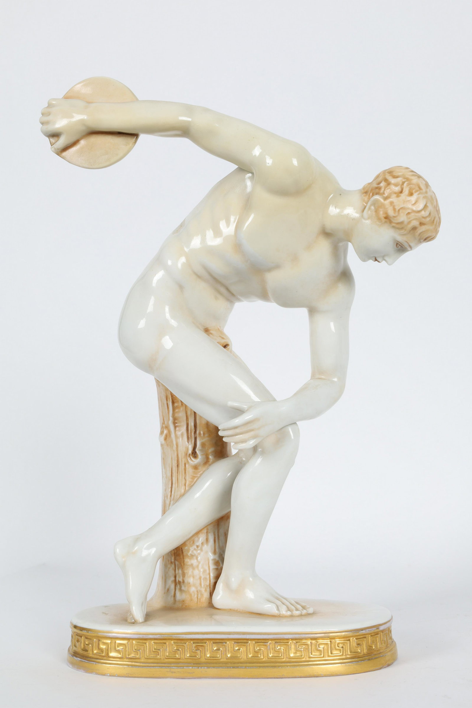 Painted Porcelain Discobolus Statue Greek Key: Painted Porcelain Discobolus Statue Greek Key Plinth. Marked on underside with crown, Capodimonte. 13 inches H x 7 x 4 deep.