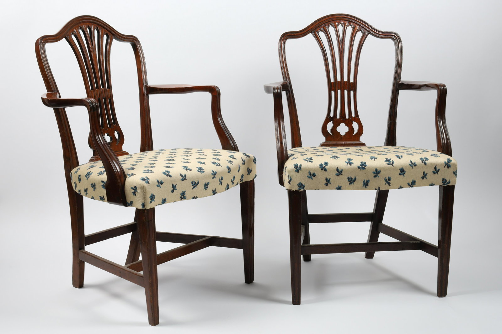 Pair English George III Hepplewhite Armchairs: Pair English George III Carved Hepplewhite Mahogany Armchairs. Measure 22 W x 18 deep x 36 inches H, seat height 18 inches.