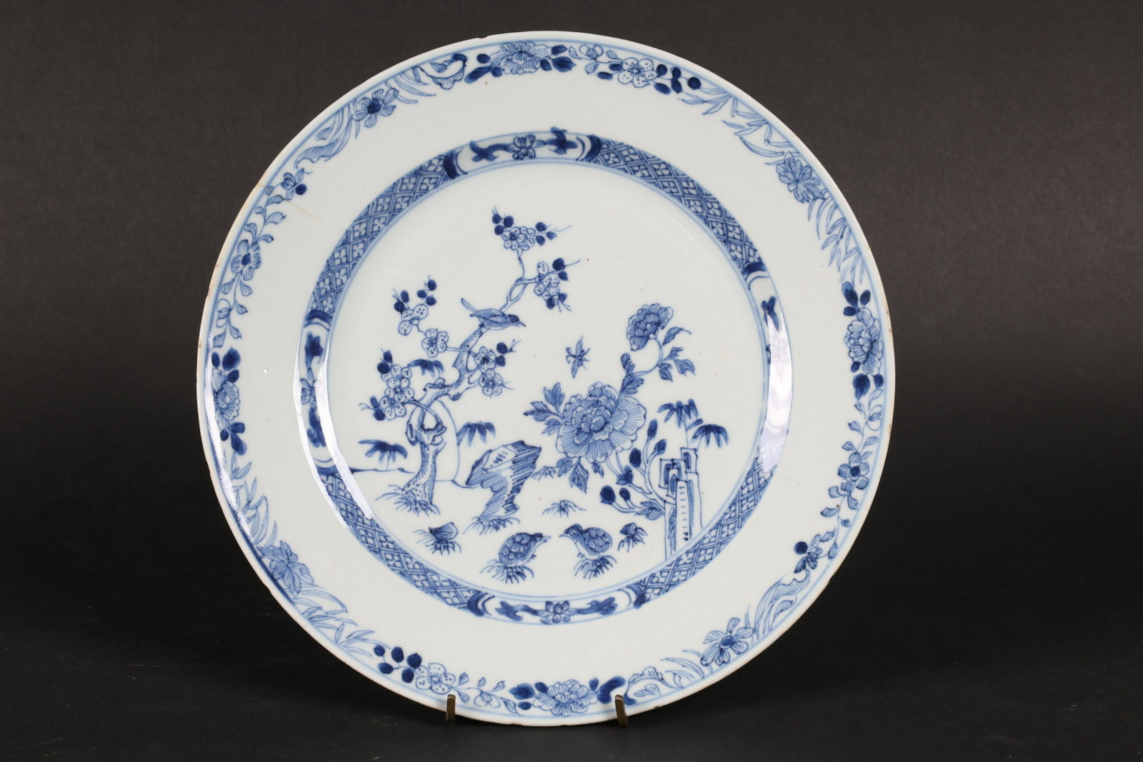 Chinese / Vietnamese Blue and White Dish: Chinese / Vietnamese Blue and White Dish. Hairline crack to rim. Painted landscape with bird. 9 inches diameter.