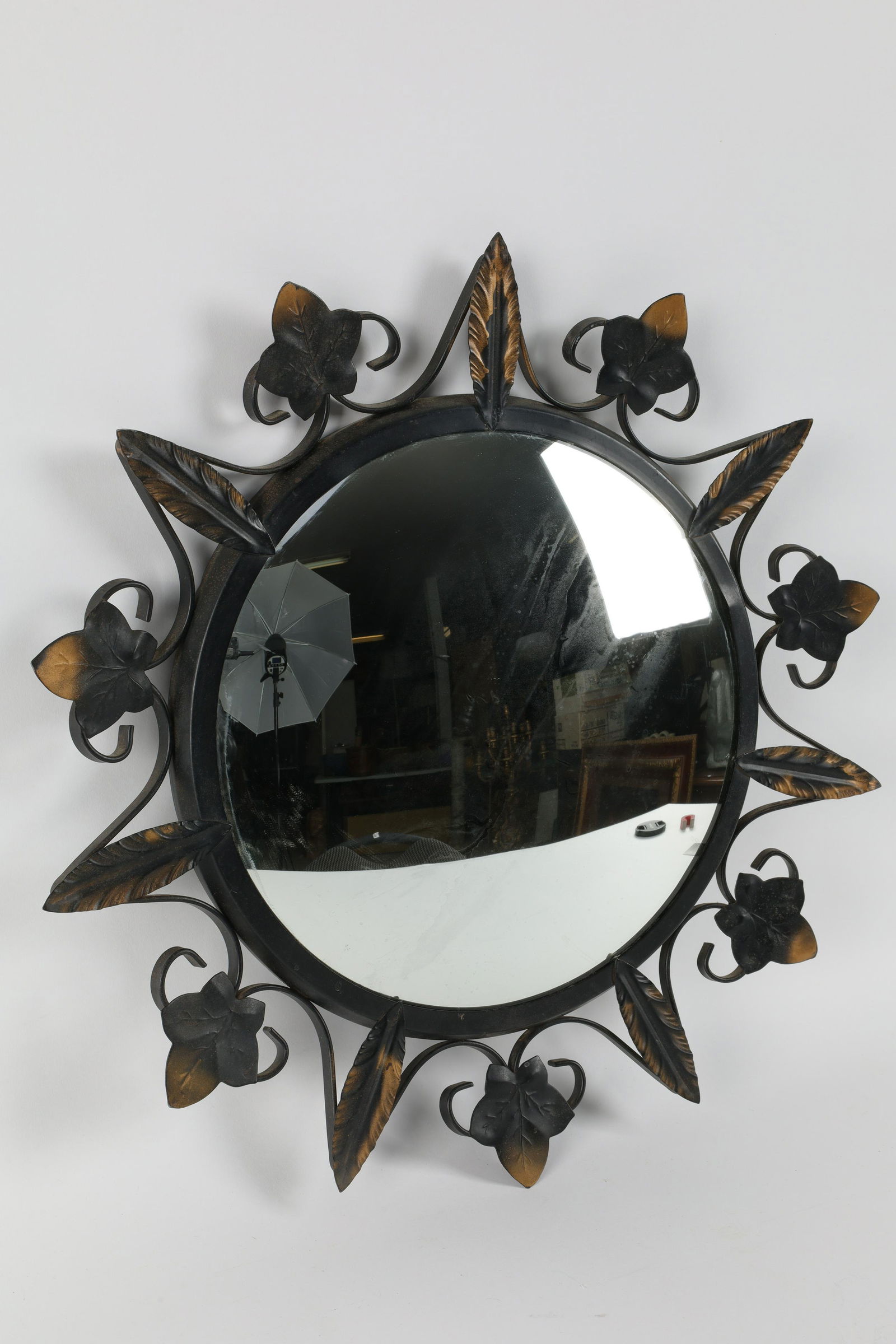 Mid Century Modern Convex Mirror in Metal Frame: Mid Century Modern Convex Mirror in Metal Frame Decorated with Leaves. 18 inches diameter.