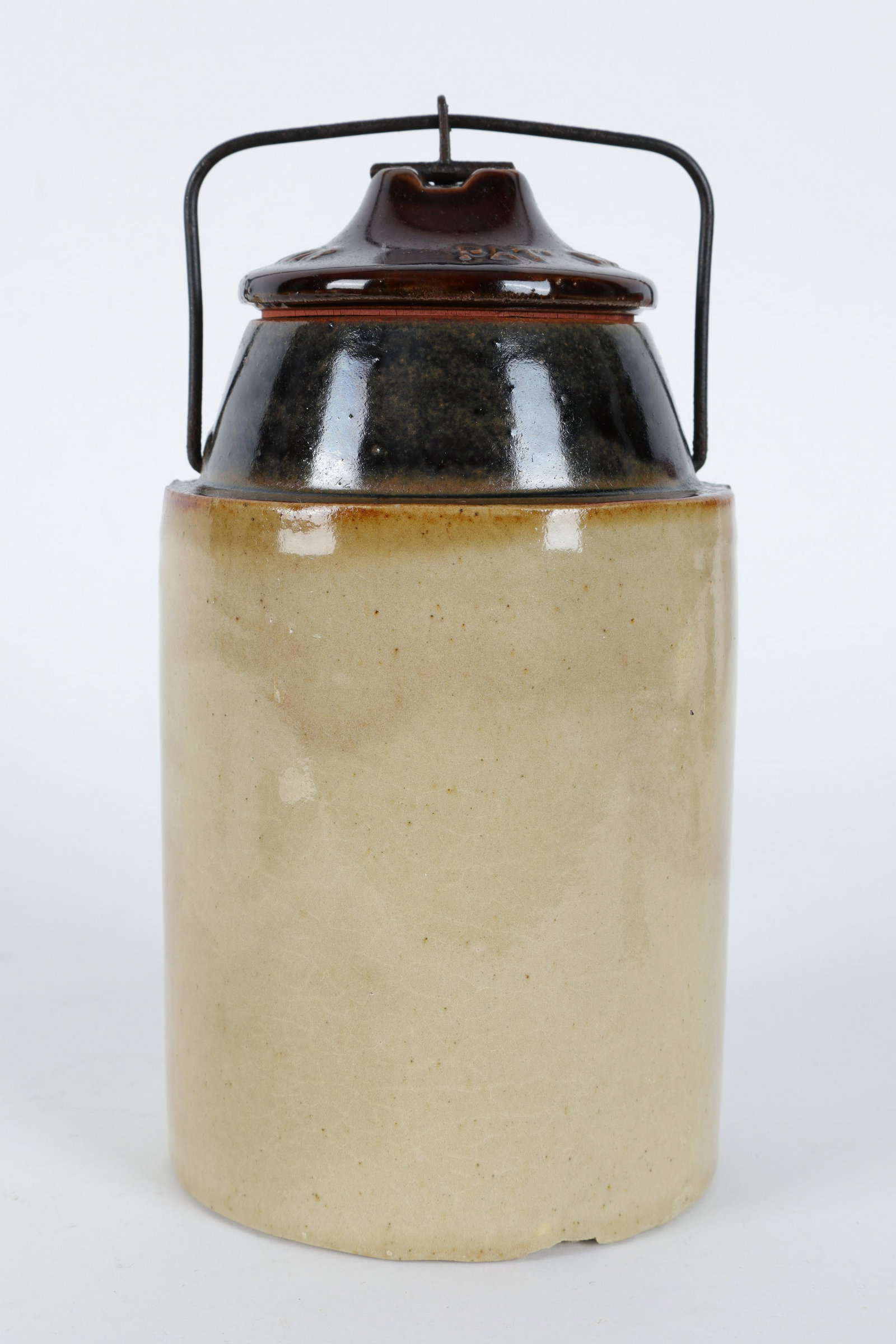 Antique Stoneware Crock Canister The Weir: Antique Stoneware Crock Canister with Wire Bail, The Weir Patent March 1st 1892. Measures 8 inches H x 4.25 diameter.