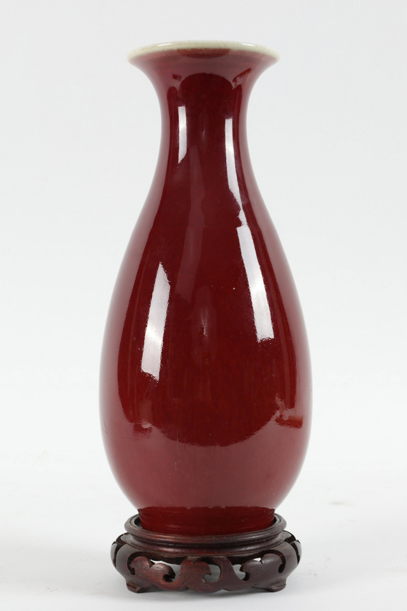Chinese Sang de Boeuf Oxblood Vase on Stand: Chinese Sang de Boeuf Oxblood Vase on Stand. 10 inches H, 11 H with stand.