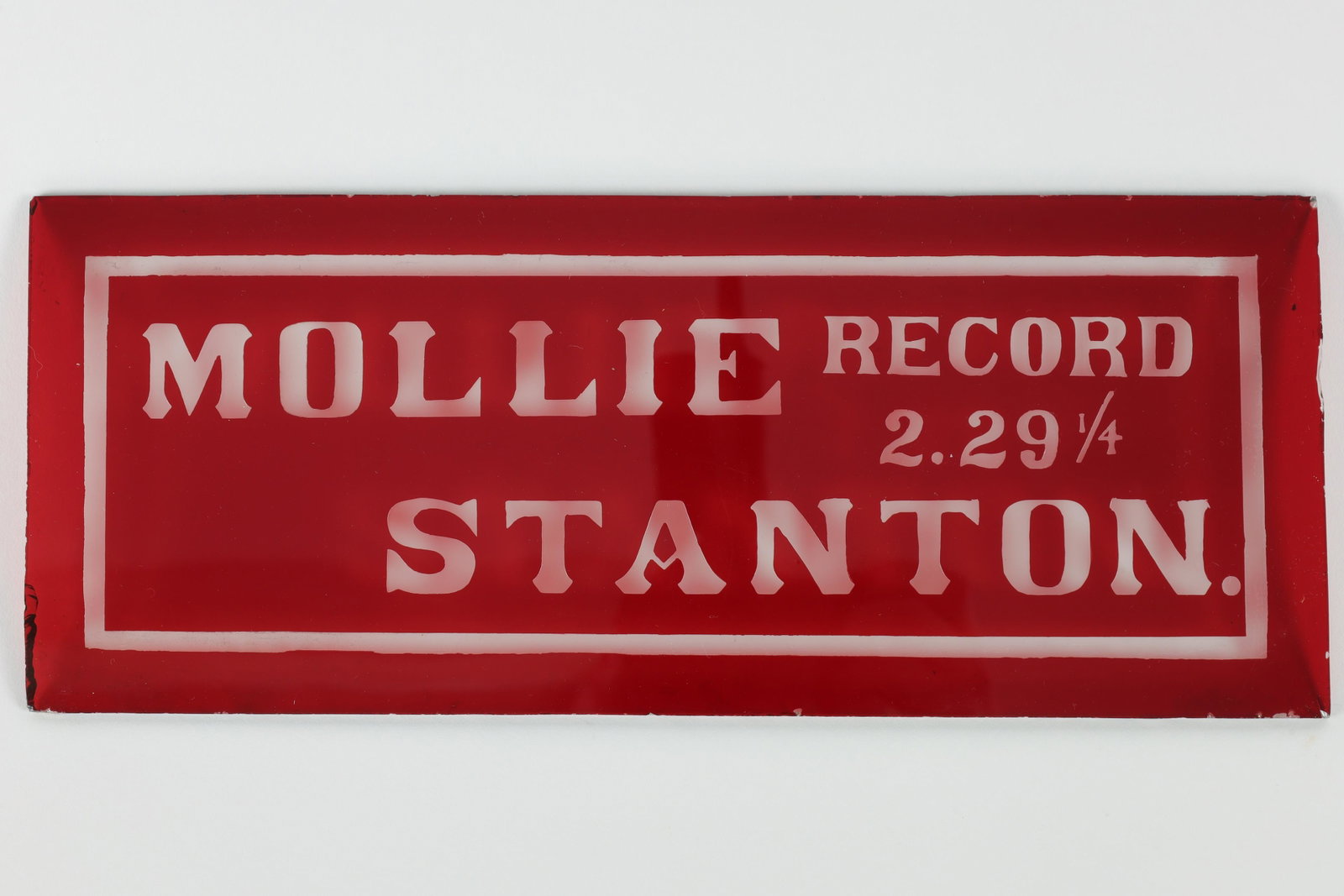 Mollie Record Stanton Red Glass Radio Station Sign: Mollie Record Stanton Cranberry Glass Radio Station Sign. Measures 4 inches H x 10 W. Some chipping to edges, please see photos.