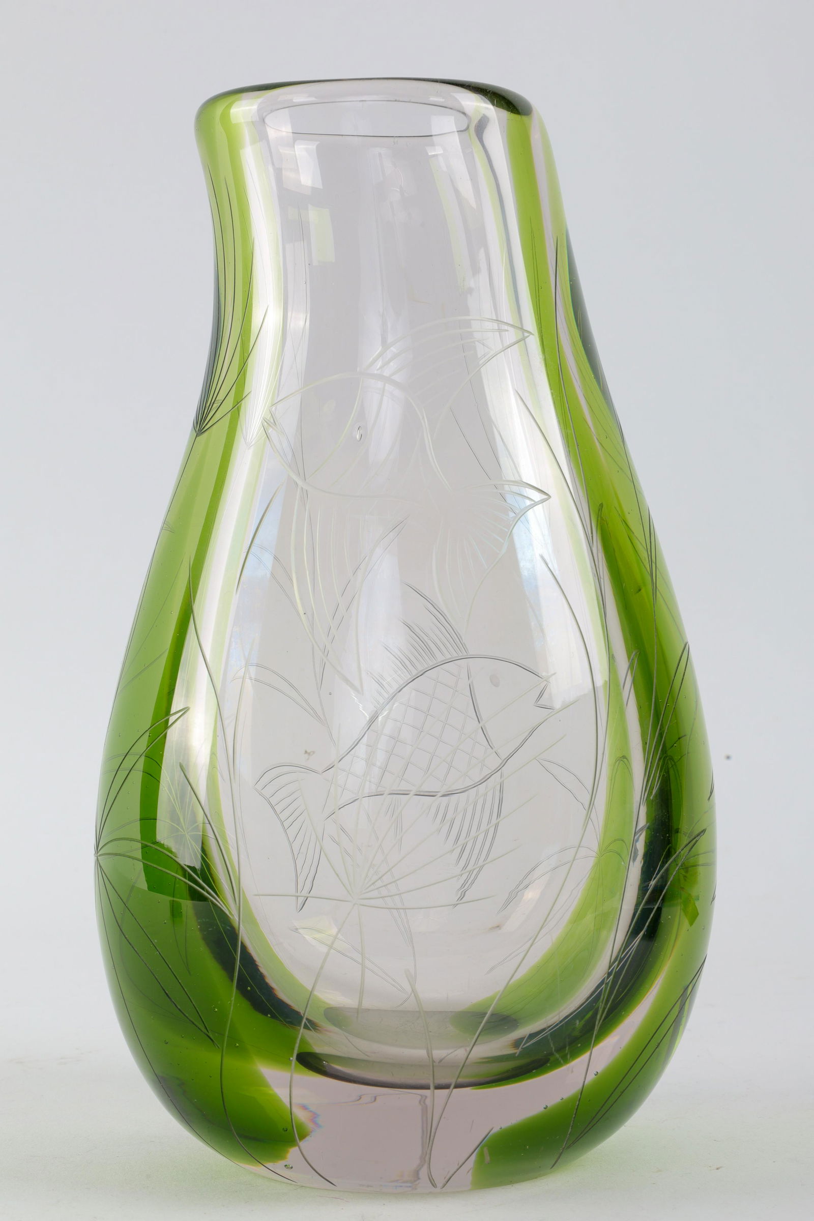 1950s Engraved Fish Glass Vase Manner Edward Hald: 1950s Green and Clear Engraved Fish Glass Vase Manner Edward Hald. 9 inches H. Tiny fleabite on leaf, some scuffs to body.