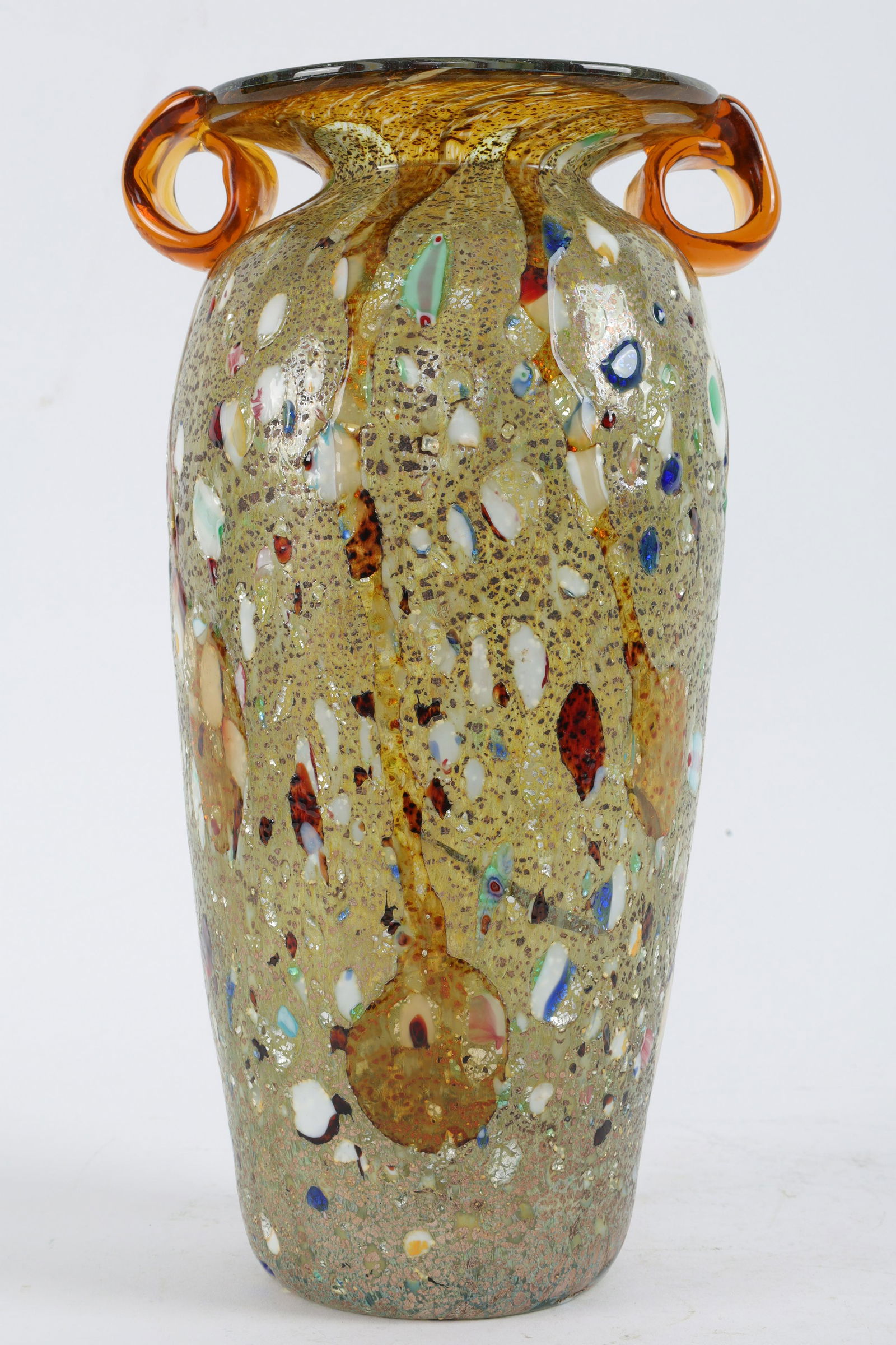 Vintage Murano Art Glass Vase: Vintage Murano Art Glass Vase with Mixed Glass Inclusions and Amber glass handles. Original Murano sticker. Measures 11.5 inches H.
