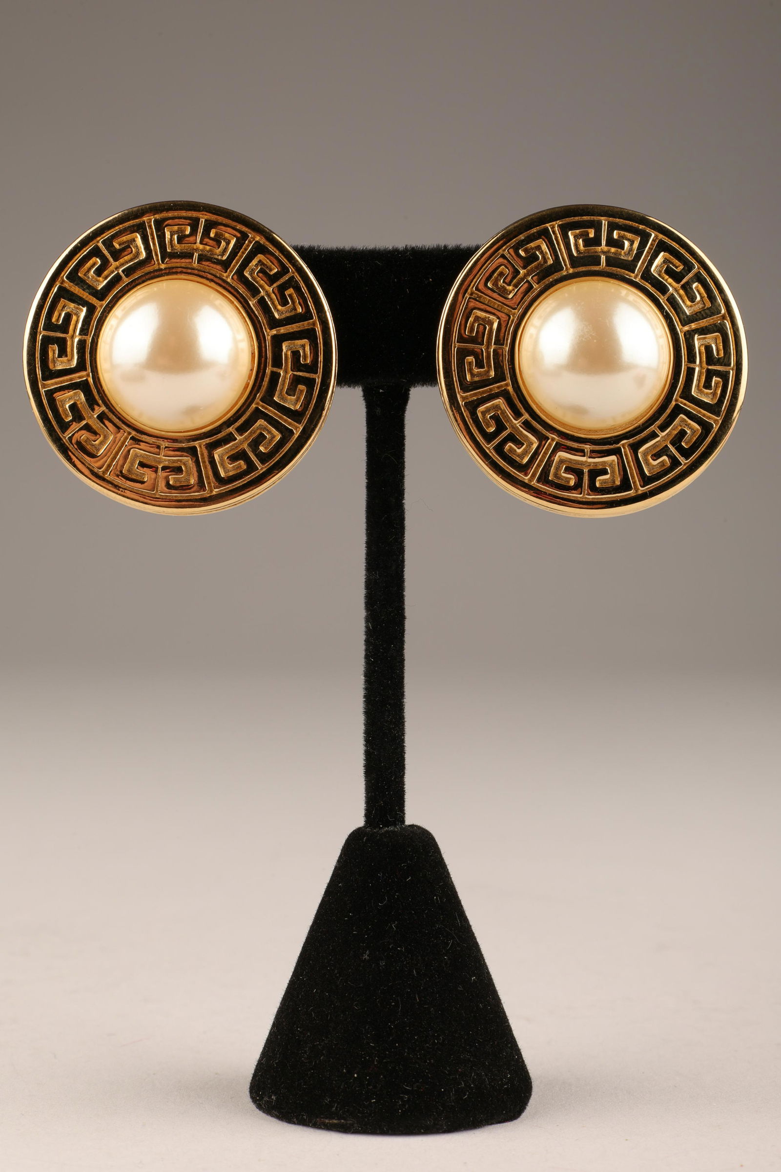 Faux Pearl Gold Tone Givenchy Paris Earrings: Vintage Faux Pearl and Gold Tone Givenchy Paris Clip on Earrings. Marked on reverse. 1.25 inches diameter.