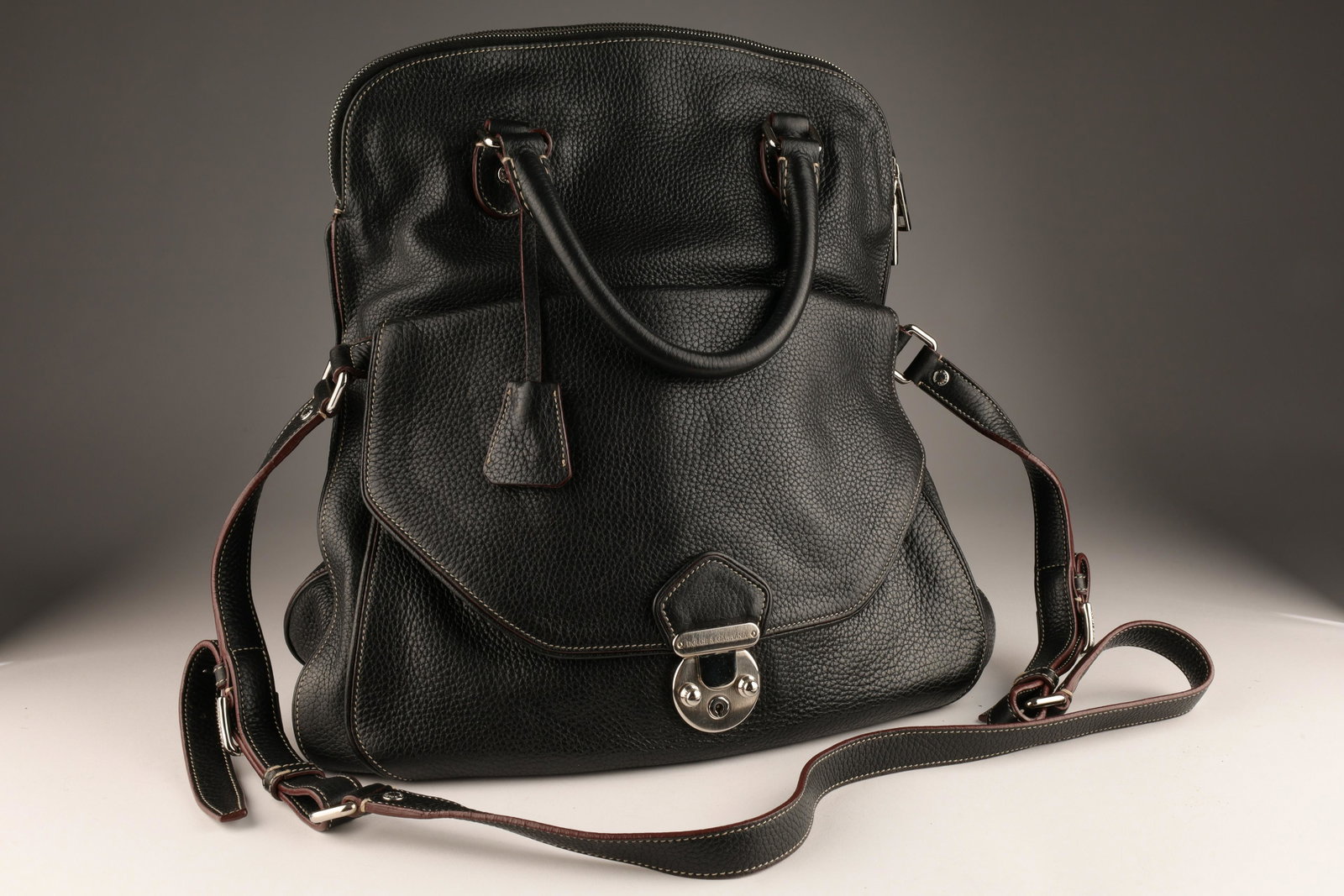 Dolce and Gabbana Black Leather Miss Catch Bag: Dolce And Gabbana Black Leather Miss Catch Fold Over Tote With Olive Green Interior. 15 inches W x 16.5 H x 5 deep, 3 inch handle drop, adjustable shoulder strap 25 inches. In mint condition.