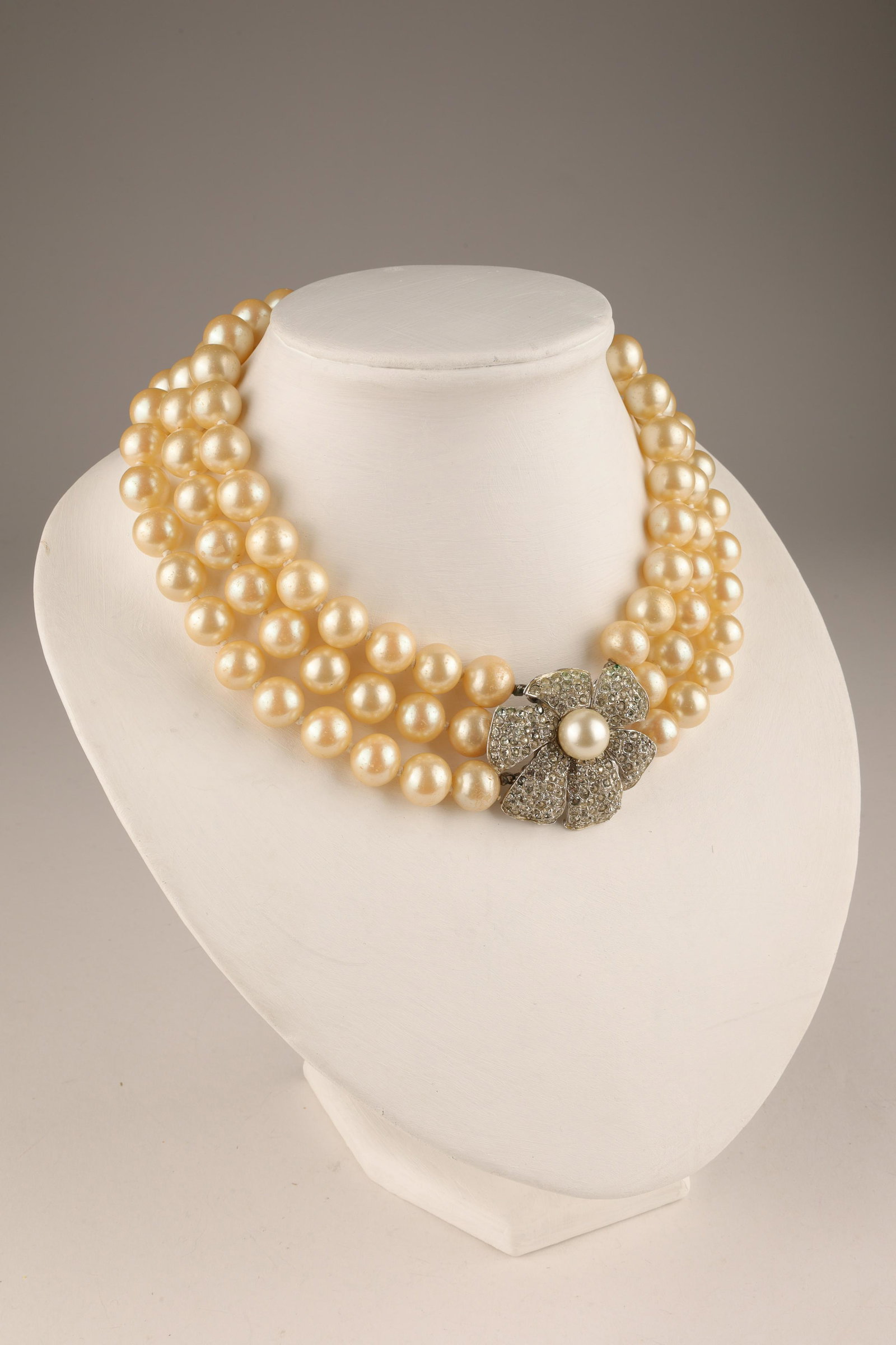 Kenneth Jay Lane Pearl Necklace Jackie Kennedy: Kenneth Jay Lane Triple Strand Pearl and Rhinestone Clasp Costume Jewelry Necklace. Similar to ones worn by Jackie Kennedy and Audrey Hepburn. Marked on clasp, KJL. Missing one rhinestone. 16 inches L